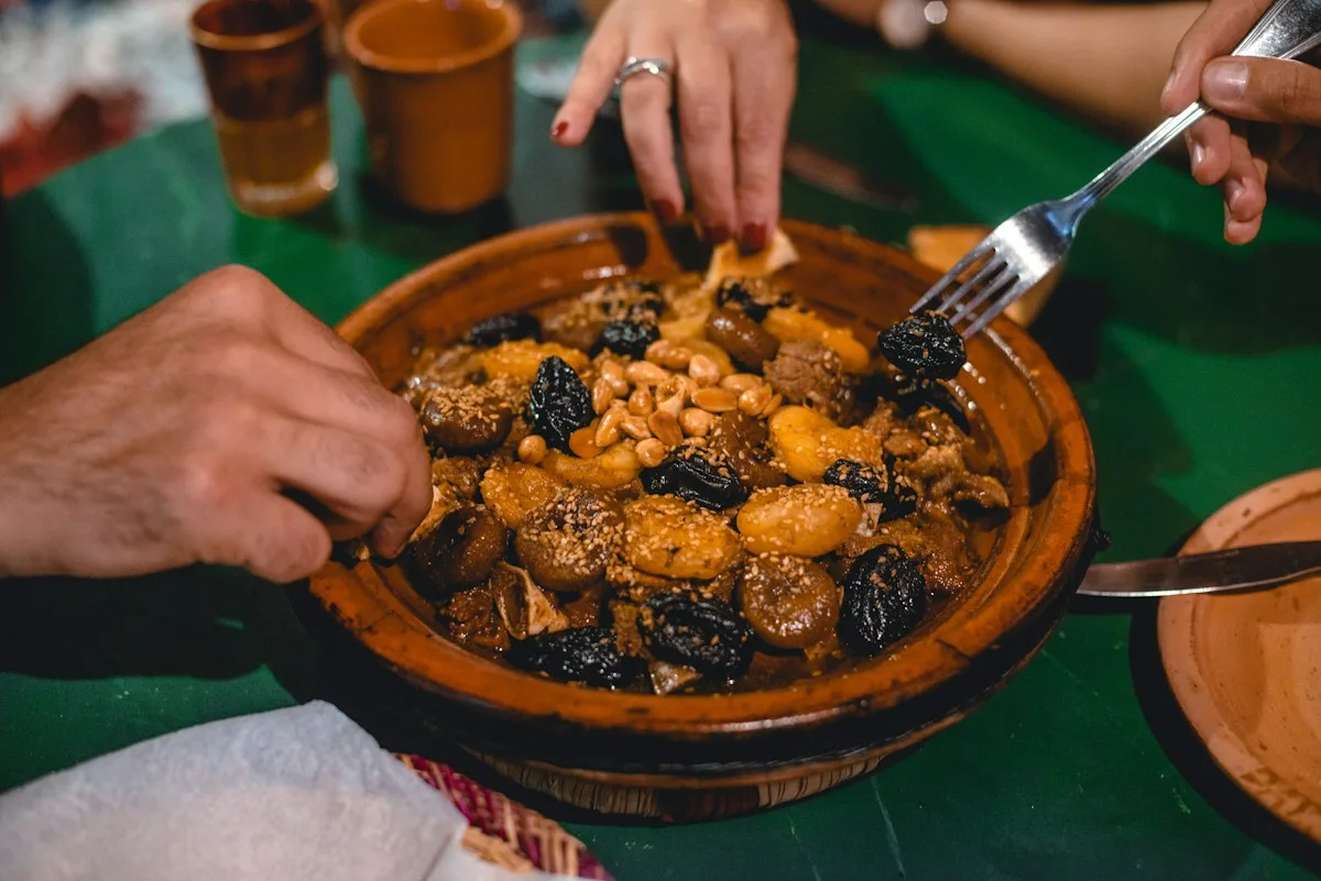 Sharing traditional Moroccan food around a table